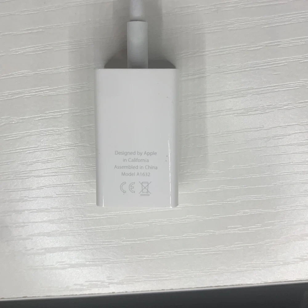 white MacBook adapter